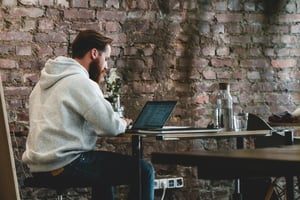 man in his office using venture capital reporting software