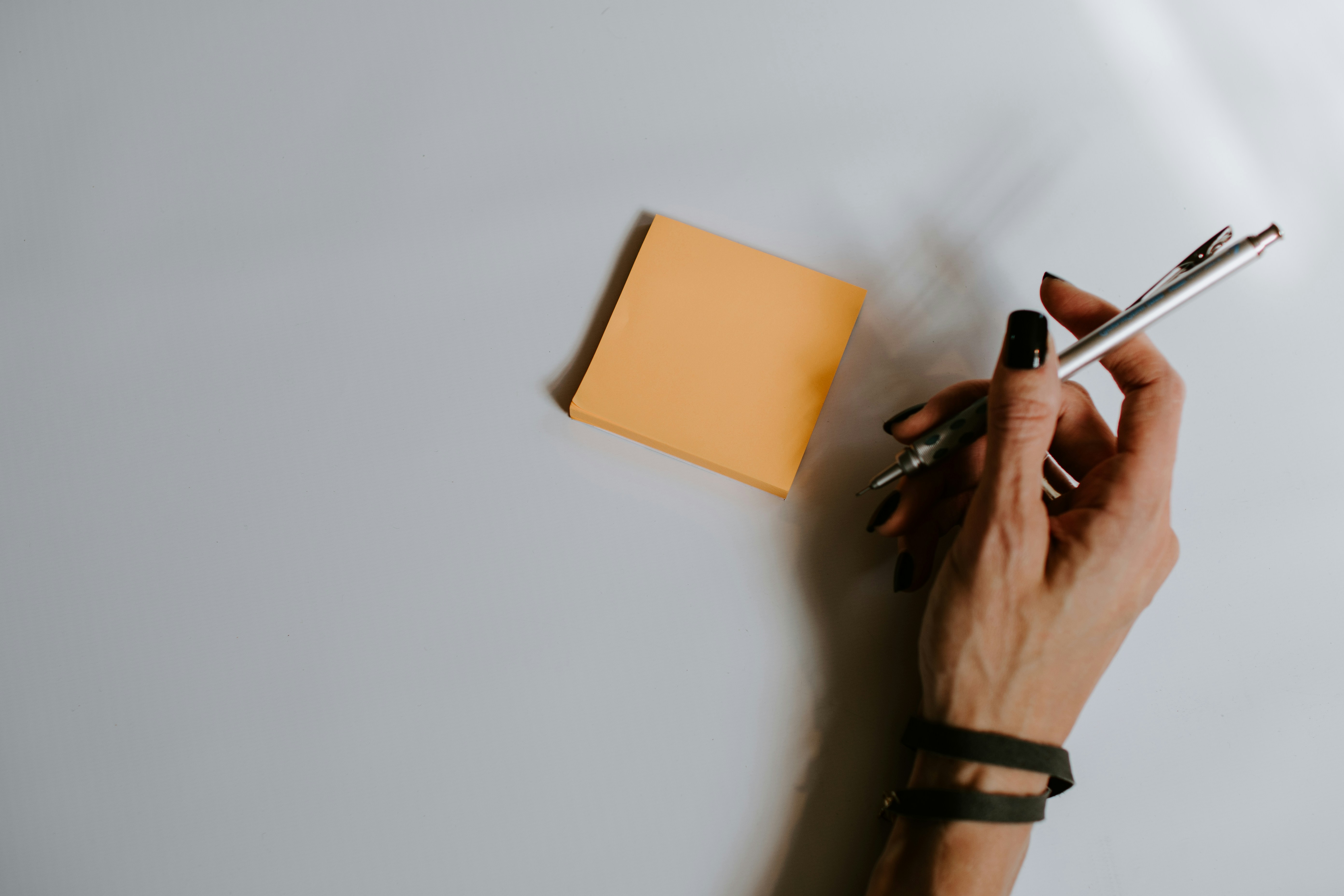 woman writing reasons to need investor relations crm