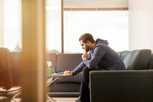 person on laptop scrolling through - venture capital funnel