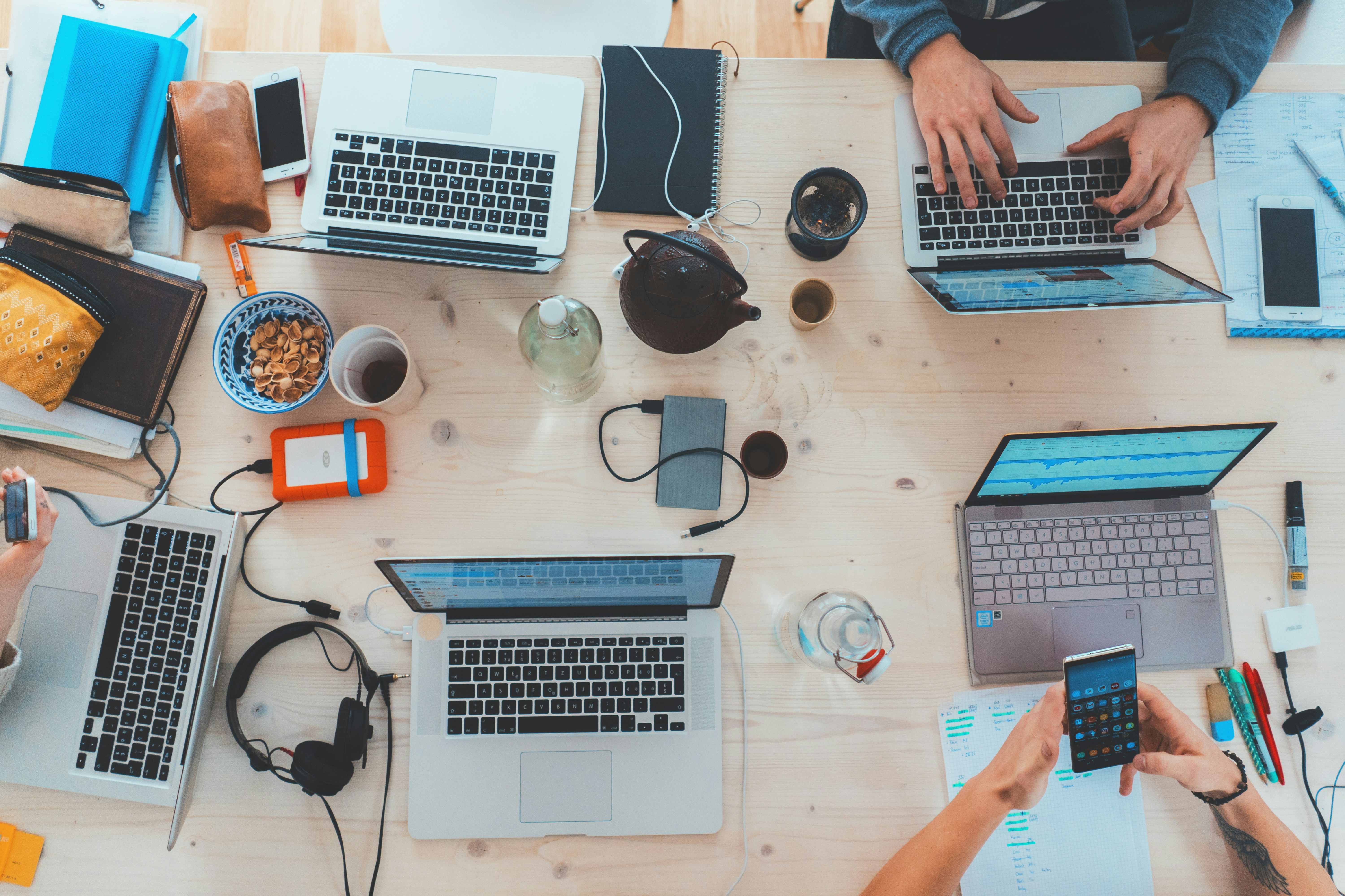 team laptops on table - vc portfolio management