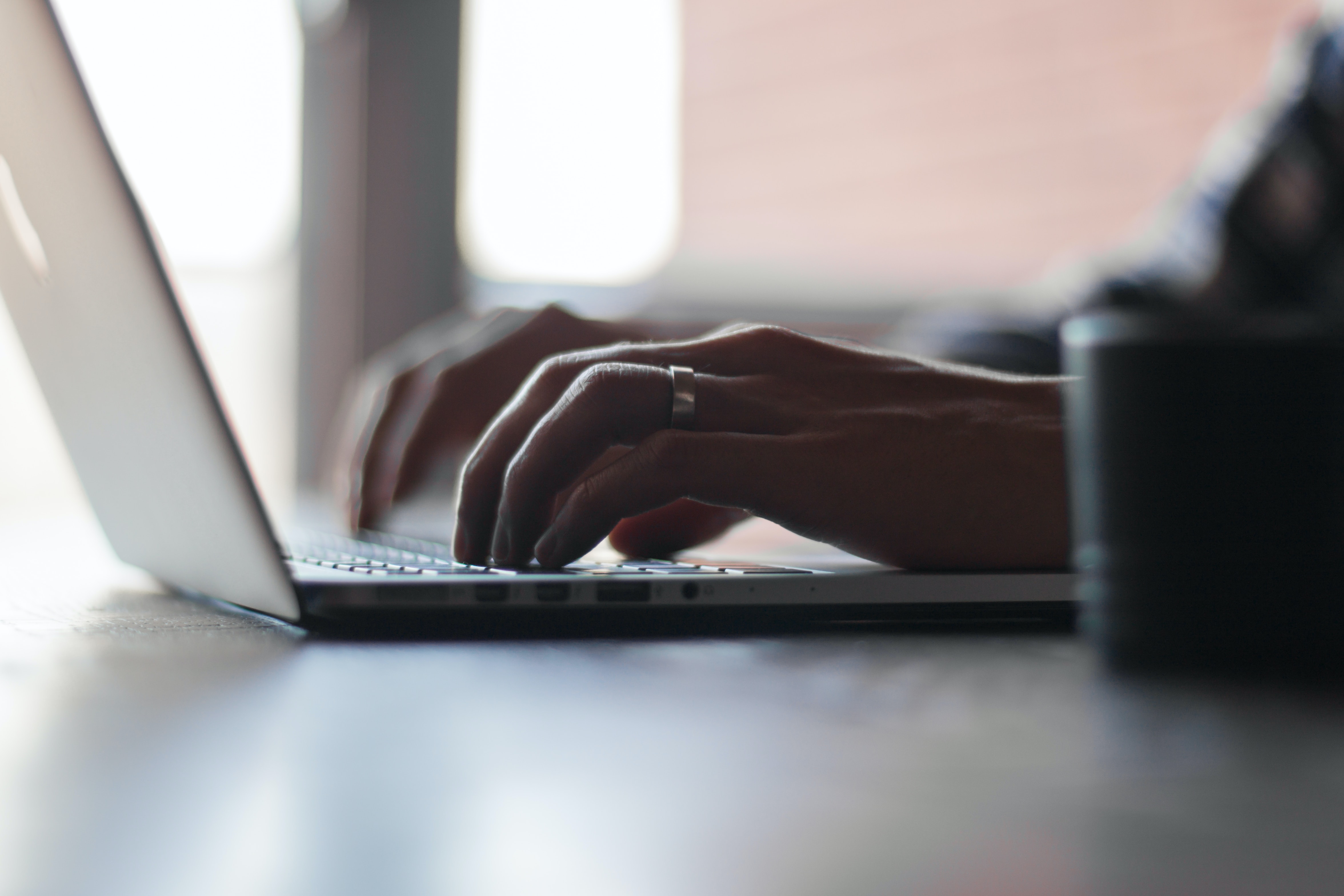 person with laptop focusing on venture capital metrics