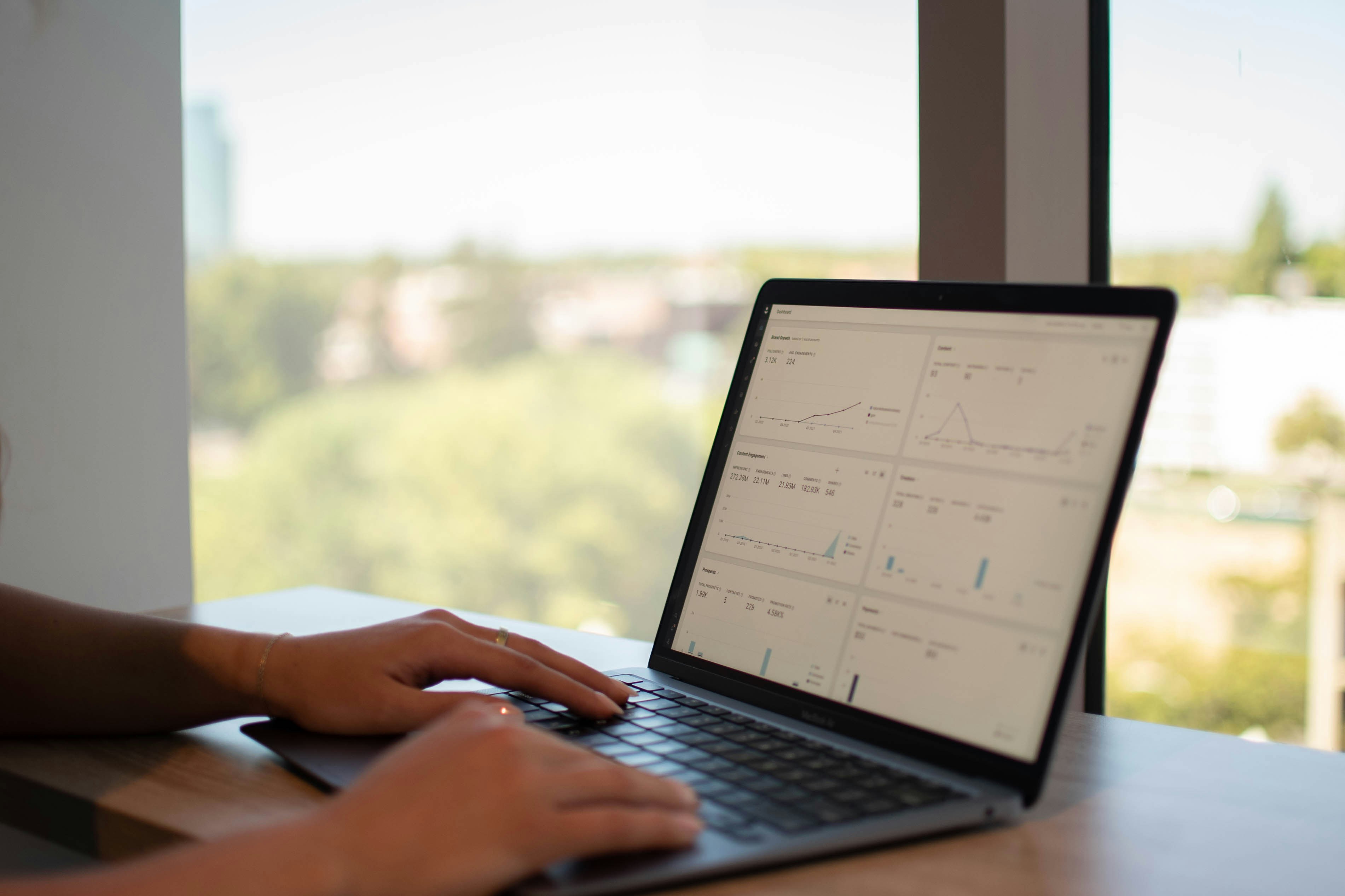 woman preparing monthly analytics performance report - investor reporting