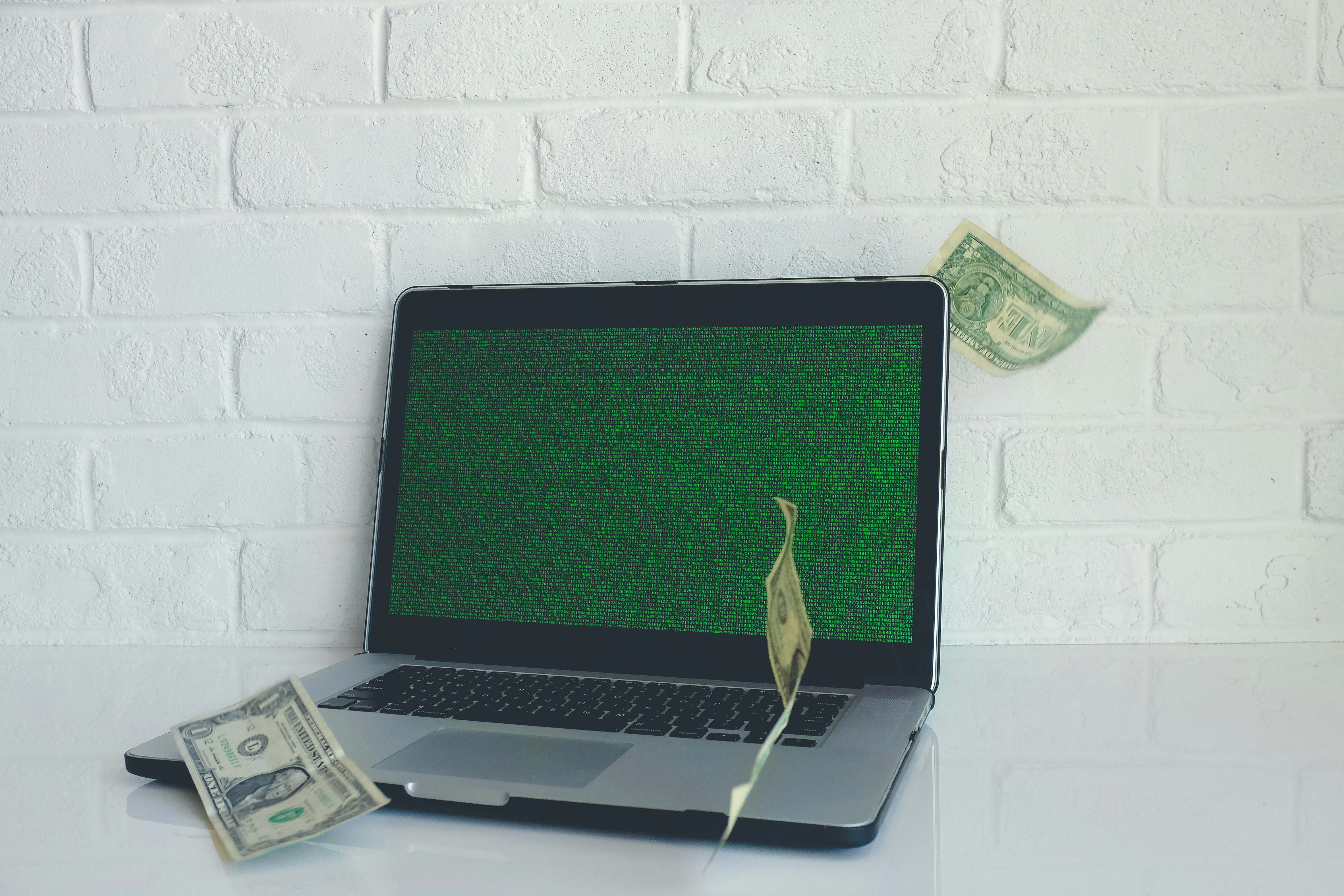 dollars with laptop signifying vc tools