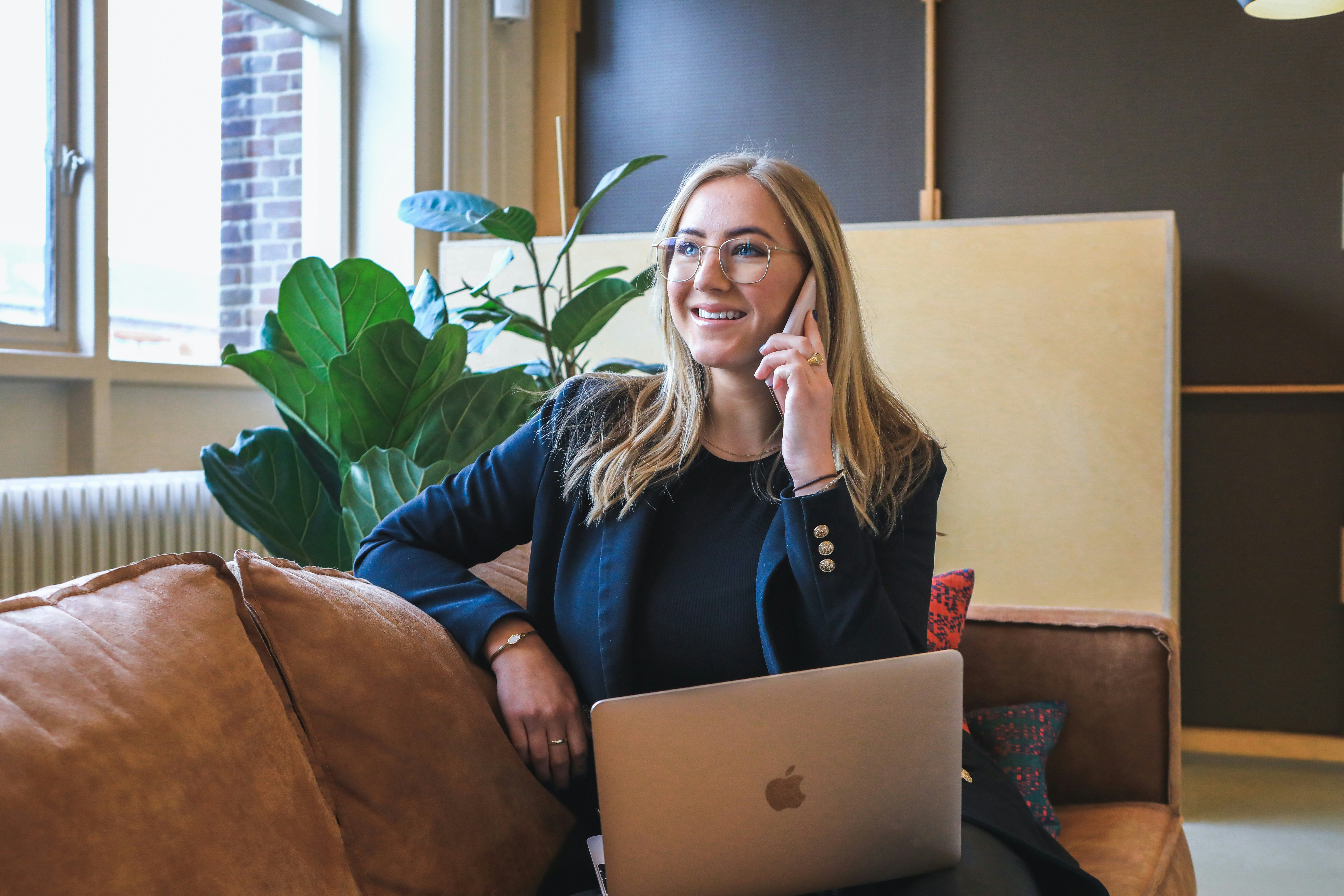 woman on call while using venture capital deal flow software